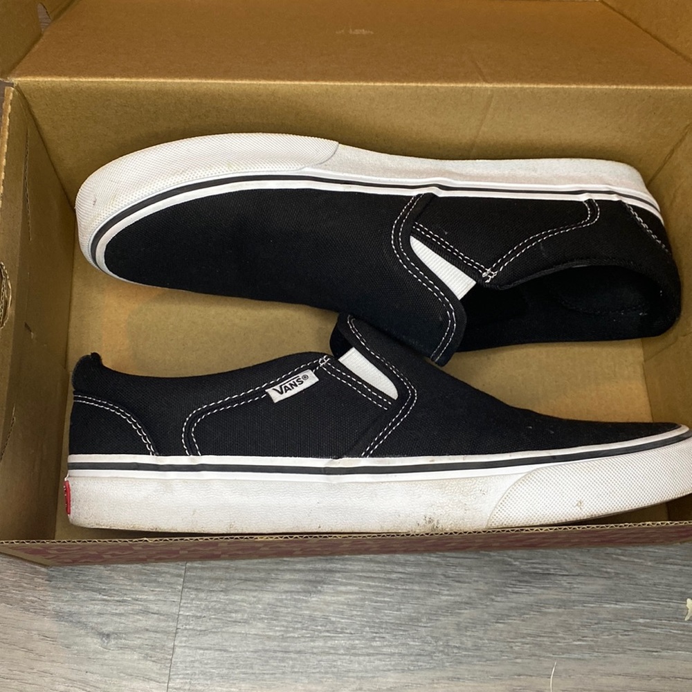 Black and white slip on vans